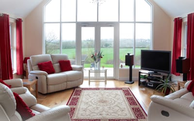 Bright interior of a living room with large windows