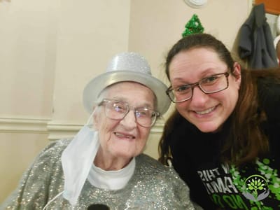 Resident and staff member posing for a selfie