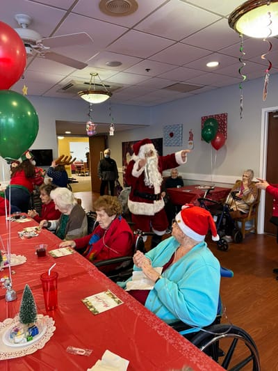 Residents celebrating with Santa during a holiday party