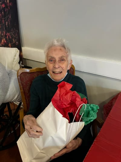 Resident enjoying gift during a celebration