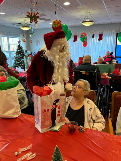 Residents enjoying a Christmas celebration with Santa