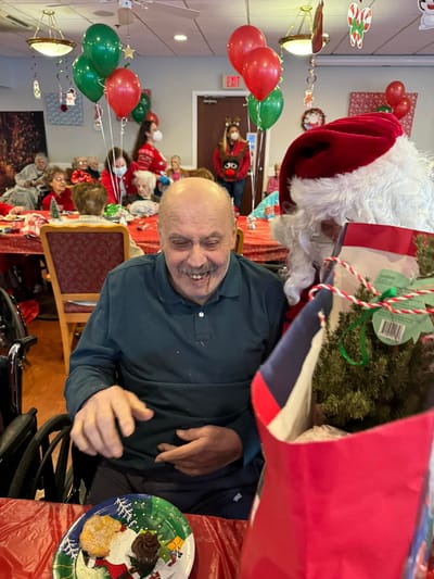 Residents celebrating with holiday decorations and treats