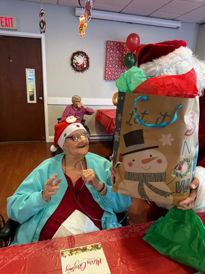 Resident enjoying a festive celebration with Santa