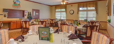 Interior view of a dining room with tables set