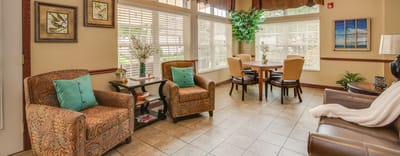 Bright common area with seating and dining table