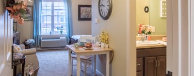 Cozy resident room with a table and sitting area