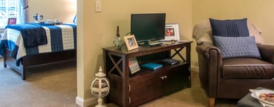 Cozy resident room with a bed and seating area