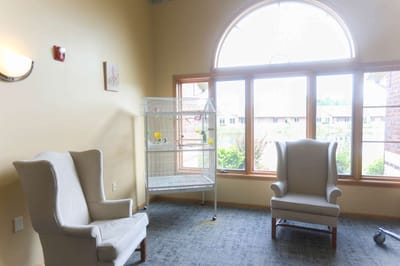 Bright seating area with large windows in the facility