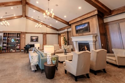 Bright common area with comfortable seating and a fireplace