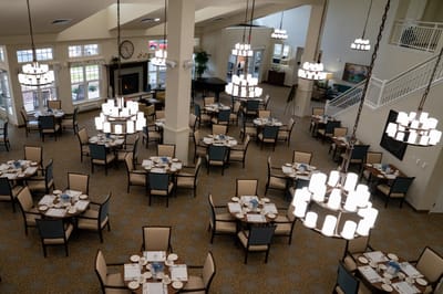 Dining area with tables set for residents
