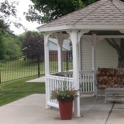 Outdoor gazebo with seating and plants