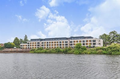 Exterior view of the facility by the water