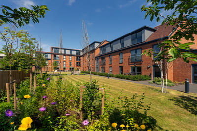 Exterior view of Savoy House with landscaped garden