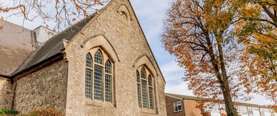 Historic building exterior with autumn trees