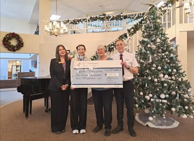 Residents and staff celebrating a donation event.
