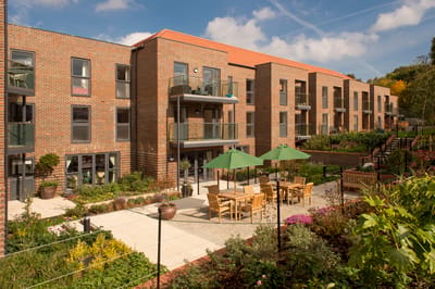 Outdoor seating area with tables and umbrellas