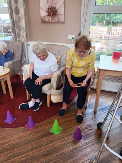 Residents engaging in an activity in a common area.
