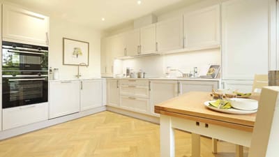 Bright kitchen with a dining table and snacks