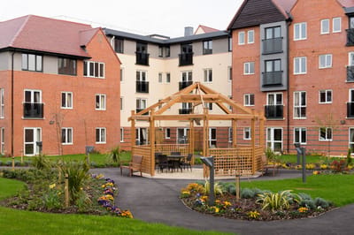 Outdoor garden area with seating and path