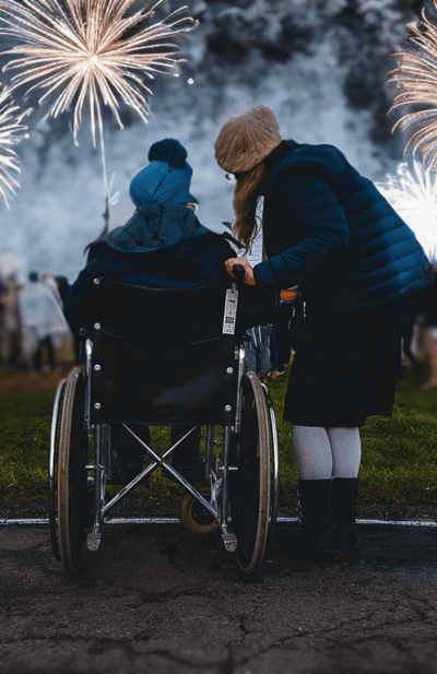 Residents enjoying a fireworks event outdoors.