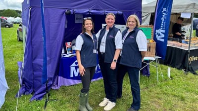 Staff members at a promotional event tent