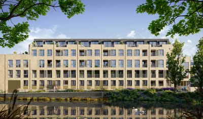 Modern assisted living facility by a pond.