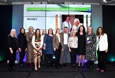 Group photo of staff celebrating an award