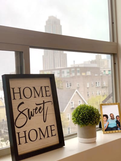 Decorative sign with family photo on a windowsill