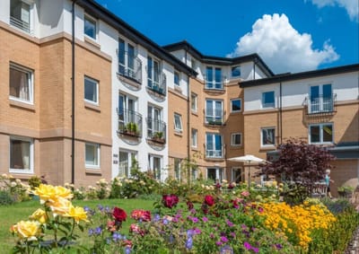 Exterior view of retirement facility with landscaped garden