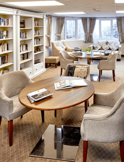 Cozy common area with bookshelves and seating
