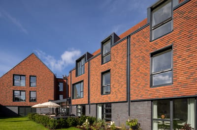 Exterior view of a modern assisted living facility.