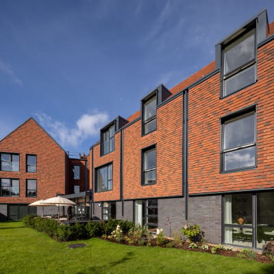 Exterior view of residential facility with garden