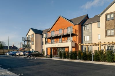 Exterior view of a modern assisted living facility.
