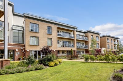Modern assisted living facility with landscaped outdoor area