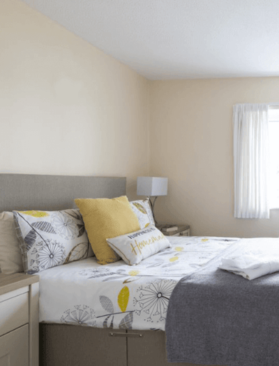 Cozy bedroom with decorative bedding and pillows