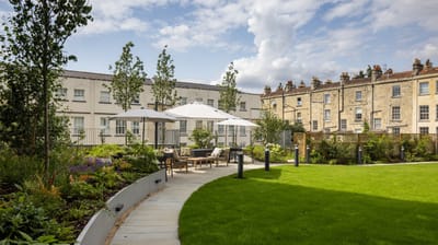 Beautiful outdoor garden area with seating and greenery.