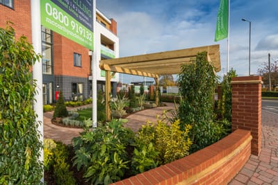 Outdoor entrance with garden and canopy