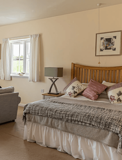 Bright and cozy resident bedroom with decor.