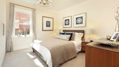 Well-furnished interior bedroom with natural light