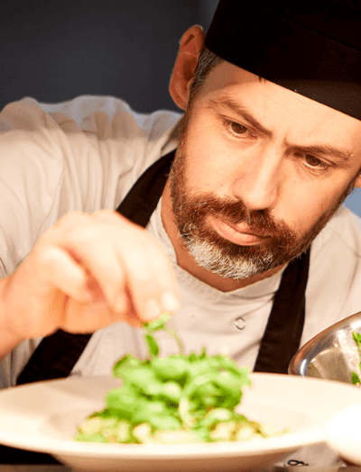 Chef preparing fresh salad dish