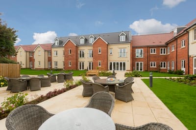 Well-maintained outdoor area with seating and landscaping