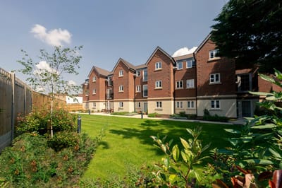 Exterior view of retirement living building and garden