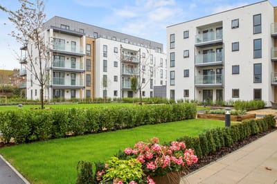 Modern residential buildings with landscaped garden.