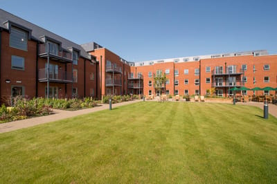 Well-maintained outdoor space with gardens and seating