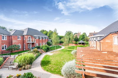Well-maintained garden area with residential buildings