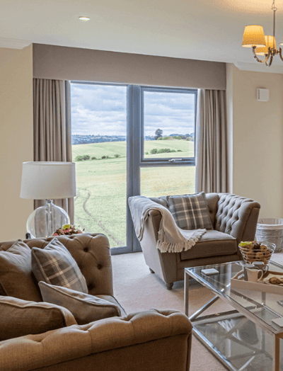 Cozy living area with a view of fields