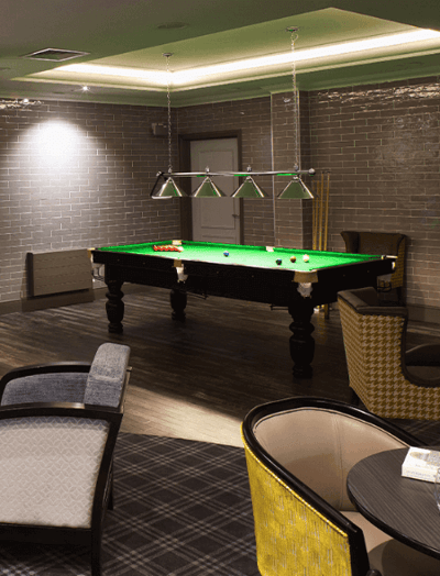 Interior space with a billiards table and seating
