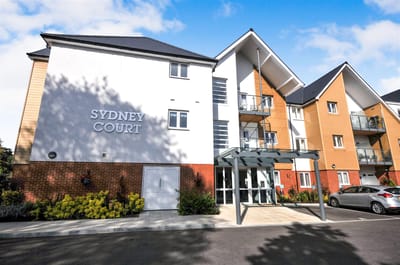 Exterior view of Sydney Court building entrance.