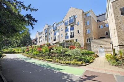 Exterior view of Savoy House with gardens.
