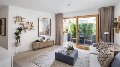 Bright and airy common area with plants and seating.